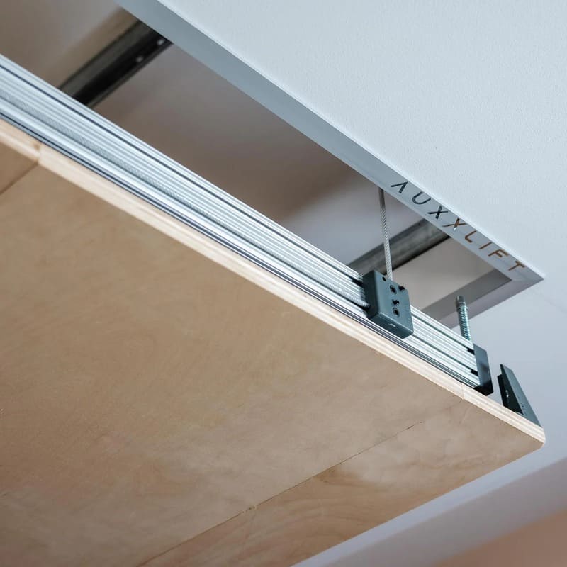 Garage organized with Auxx attic lift