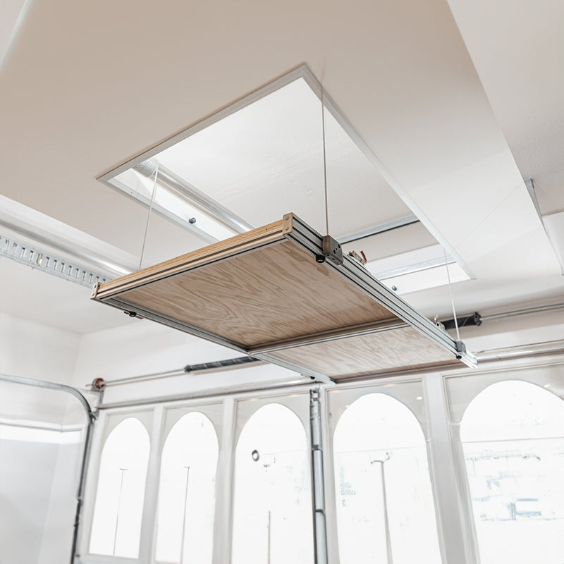 Heavy-duty Auxx attic lift with pulley mechanism