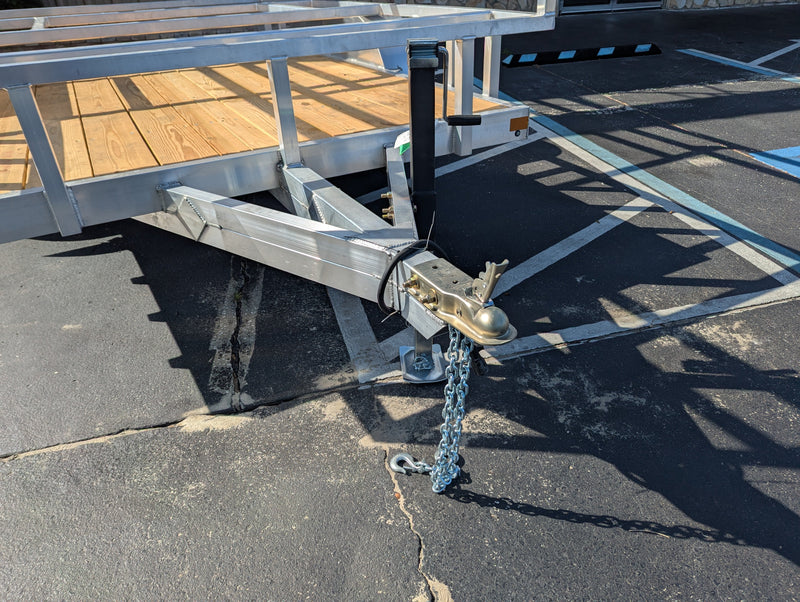Alcom trailer with full cage and ladder rack